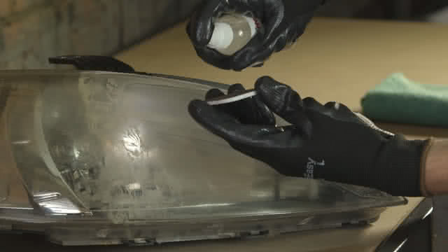 Spraying lube to pad