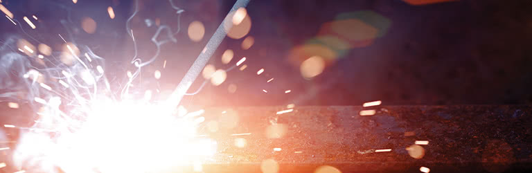 Person using a stick welder