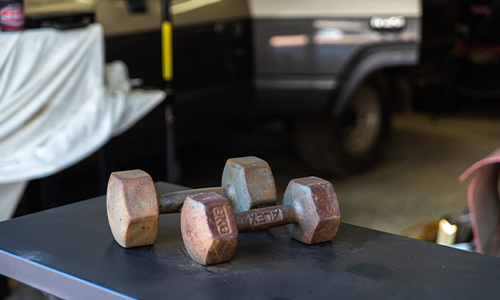 Rusted weights on a bench